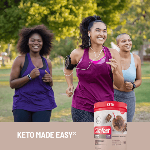 Three women running outdoors with a SlimFast Keto protein powder container in the foreground.