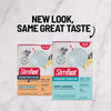 Two SlimFast Berry Lemonade packages on a white marble background with text 'New Look, Same Great Taste'.