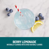 Berry lemonade with blueberries and a lemon wedge on a marble surface